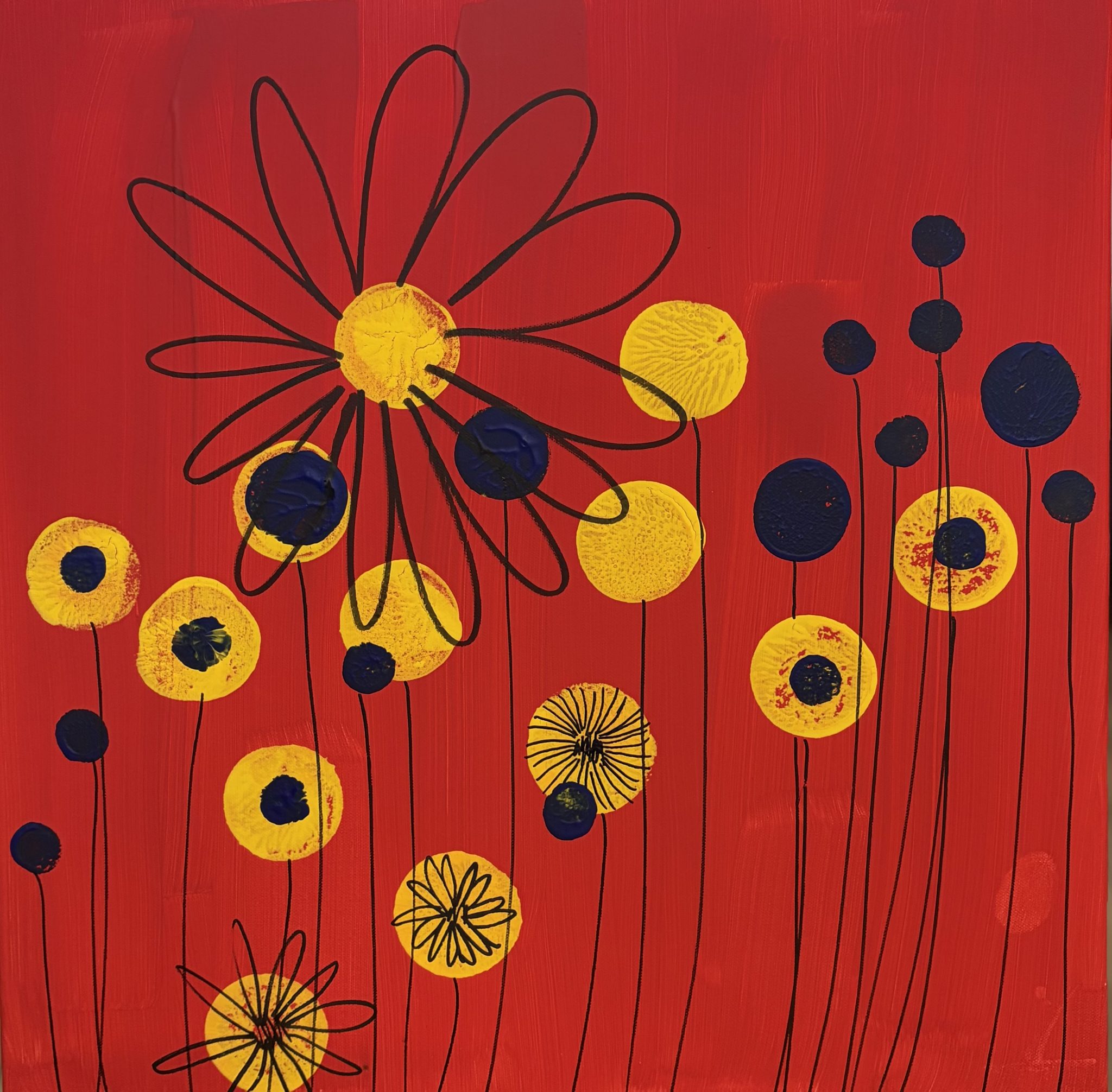 Acrylic painting of stylized yellow daisies and blue dots on a vibrant red canvas